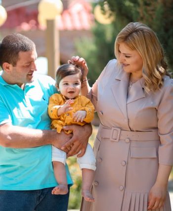 Family enjoying a sunny day outdoors, showcasing love and connection.
