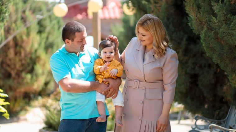 Family enjoying a sunny day outdoors, showcasing love and connection.