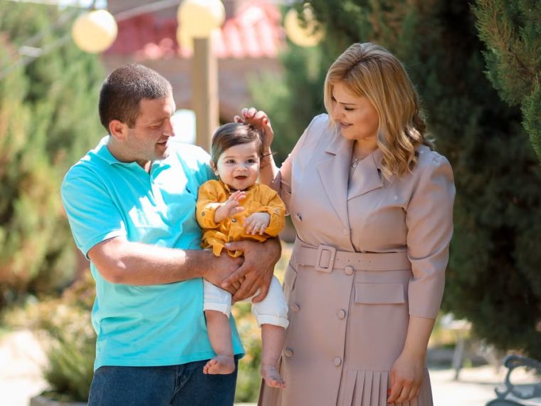 Family enjoying a sunny day outdoors, showcasing love and connection.